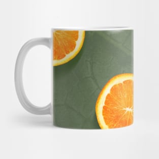 Oranges slices pattern background, fresh fruits on green background Mug